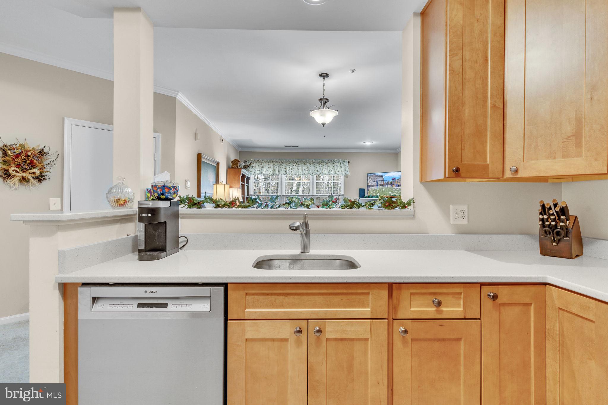 7706 Haynes Point Way, Unit 8F Alexandria, VA 22315 - Photo 14 of 36 a kitchen with stainless steel appliances granite countertop a sink and a white cabinets
