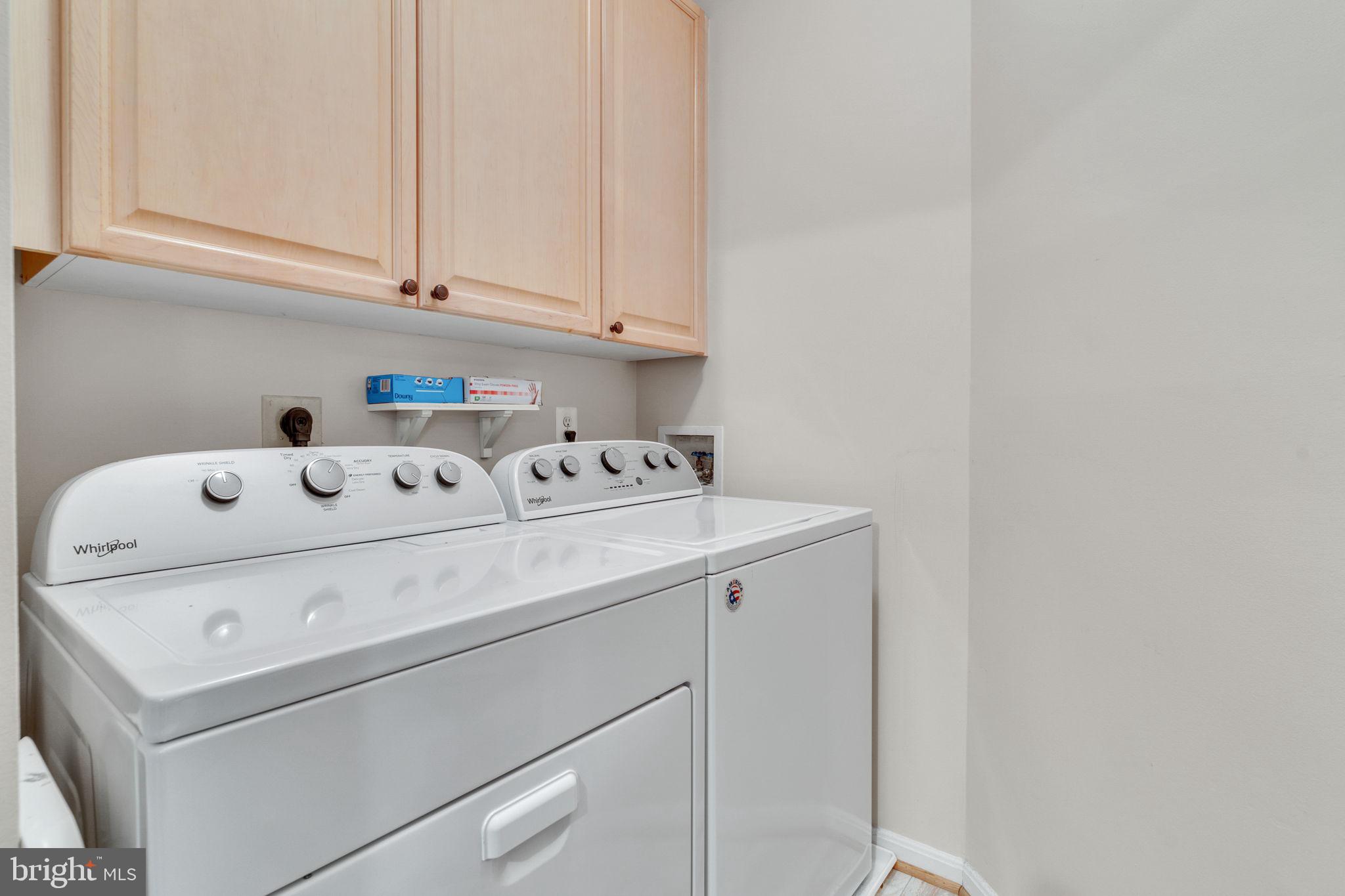 7706 Haynes Point Way, Unit 8F Alexandria, VA 22315 - Photo 15 of 36 a utility room with dryer and washer