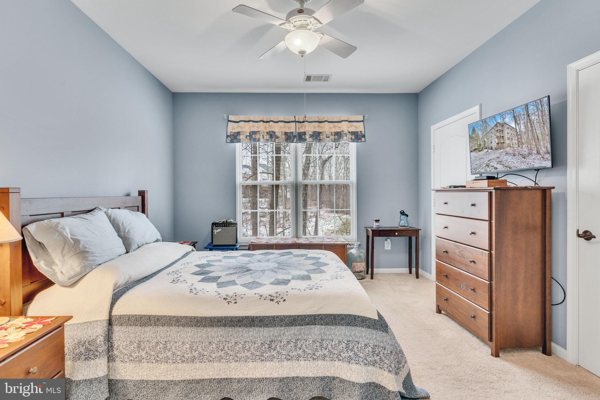 7706 Haynes Point Way, Unit 8F Alexandria, VA 22315 - Photo 18 of 36 a bedroom with a large bed and a window