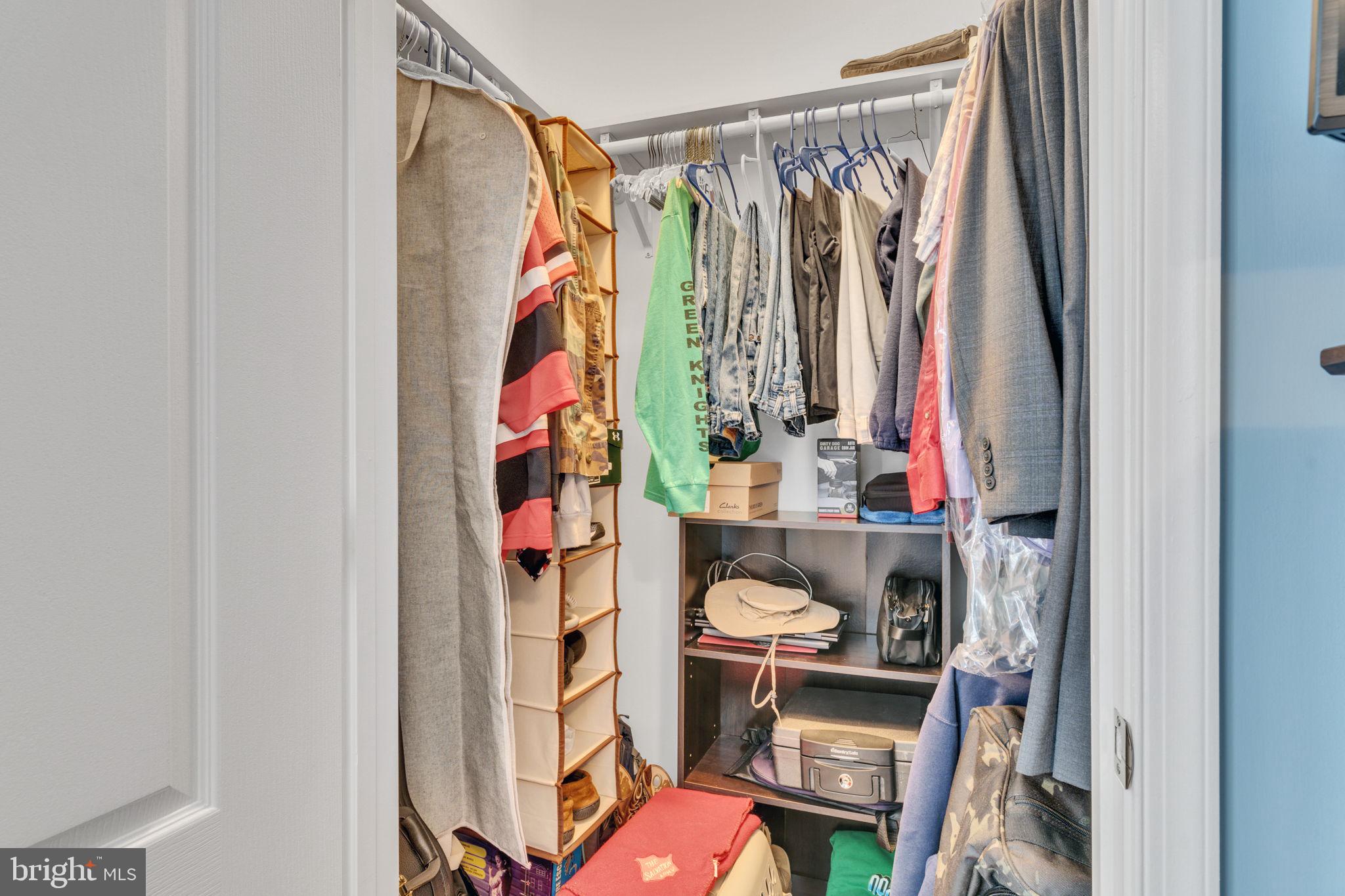 7706 Haynes Point Way, Unit 8F Alexandria, VA 22315 - Photo 21 of 36 a view of walk in closet with clothes and shoes