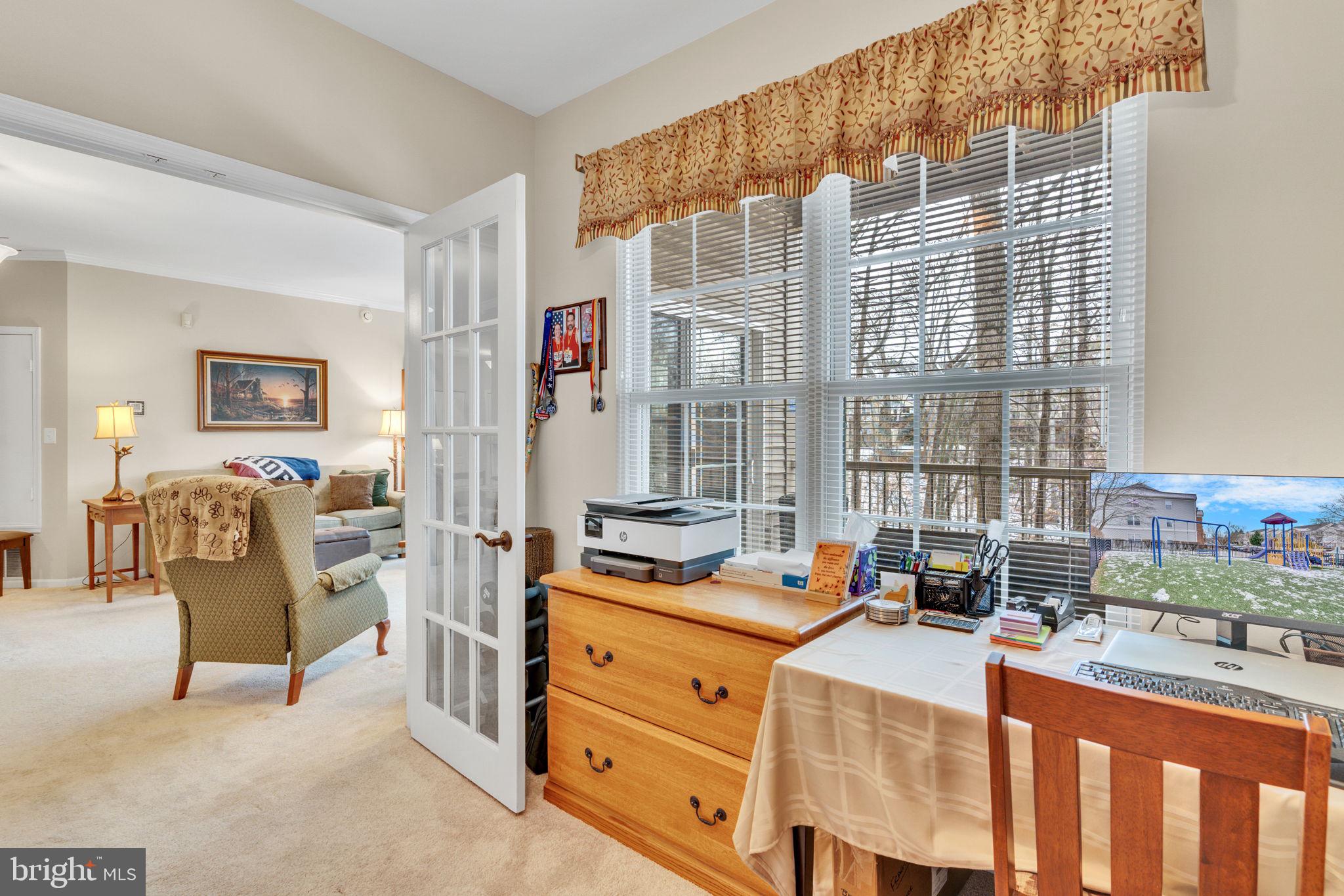 7706 Haynes Point Way, Unit 8F Alexandria, VA 22315 - Photo 26 of 36 a bed room with furniture and a window