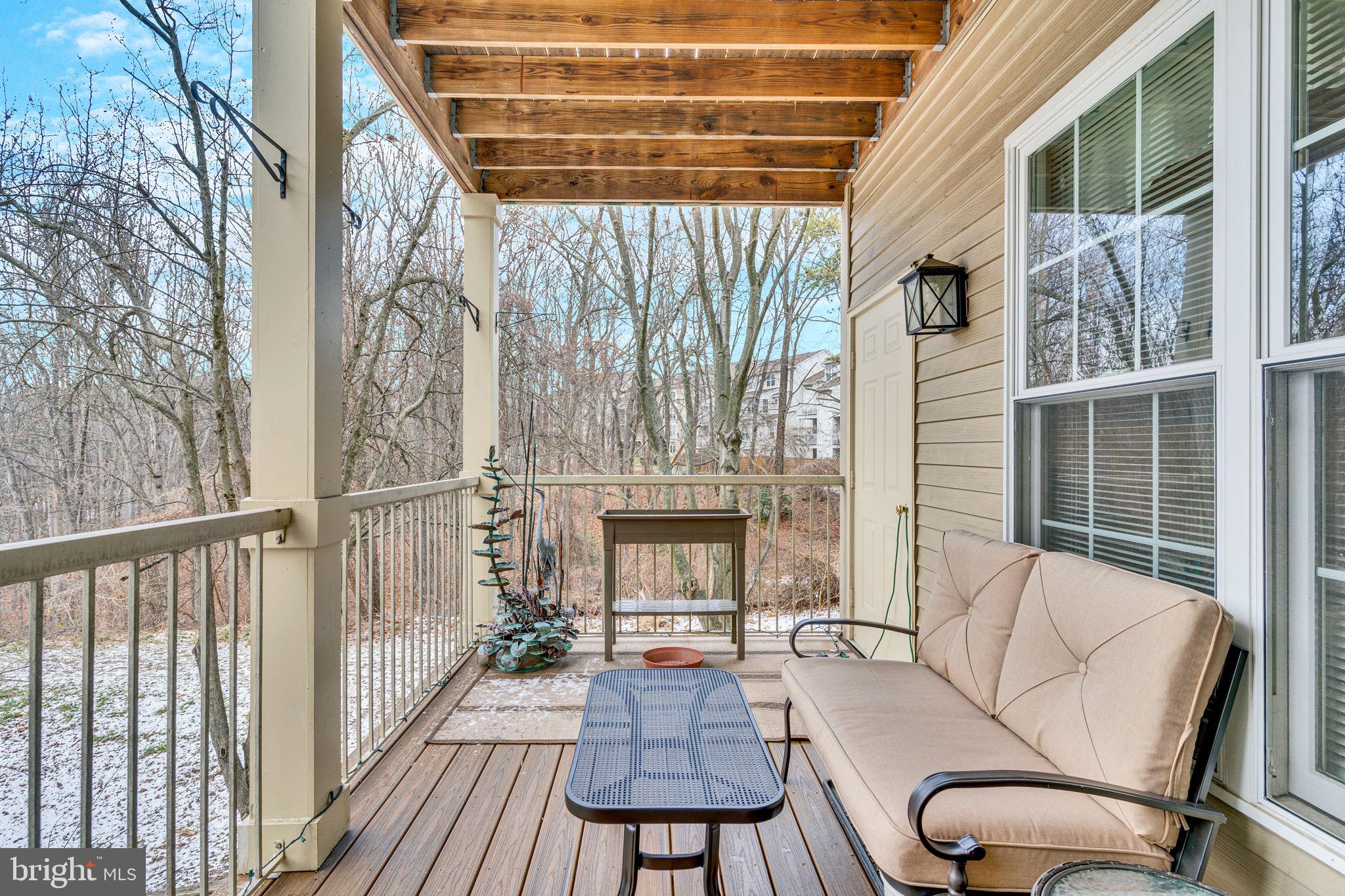 7706 Haynes Point Way, Unit 8F Alexandria, VA 22315 - Photo 28 of 36 a view of a balcony with chairs and a potted plant