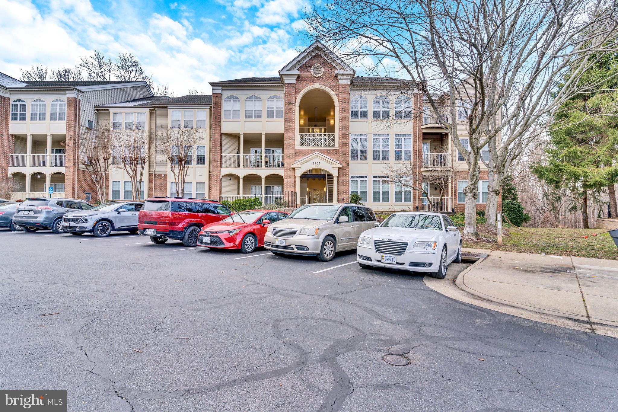 7706 Haynes Point Way, Unit 8F Alexandria, VA 22315 - Photo 32 of 36 a cars parked in front of a building