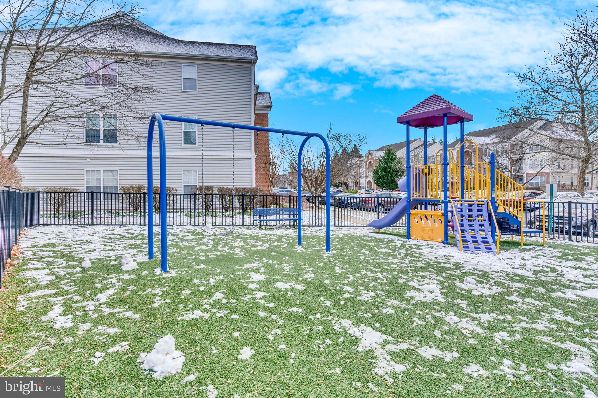 7706 Haynes Point Way, Unit 8F Alexandria, VA 22315 - Photo 35 of 36 a view of tall trees with a yard