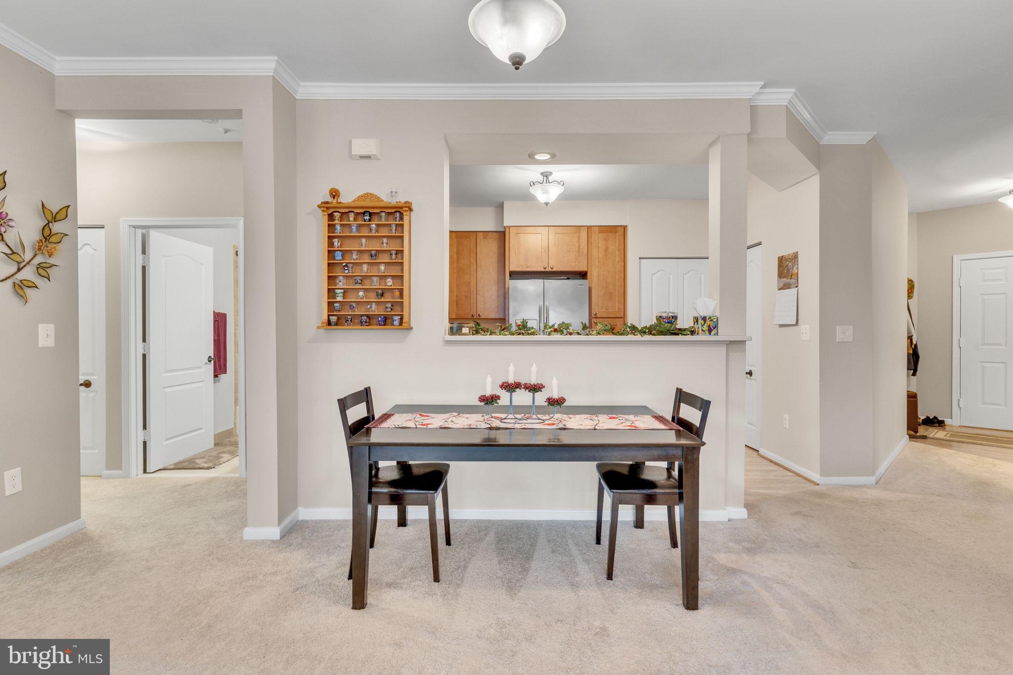 7706 Haynes Point Way, Unit 8F Alexandria, VA 22315 - Photo 8 of 36 a view of a dining room with furniture