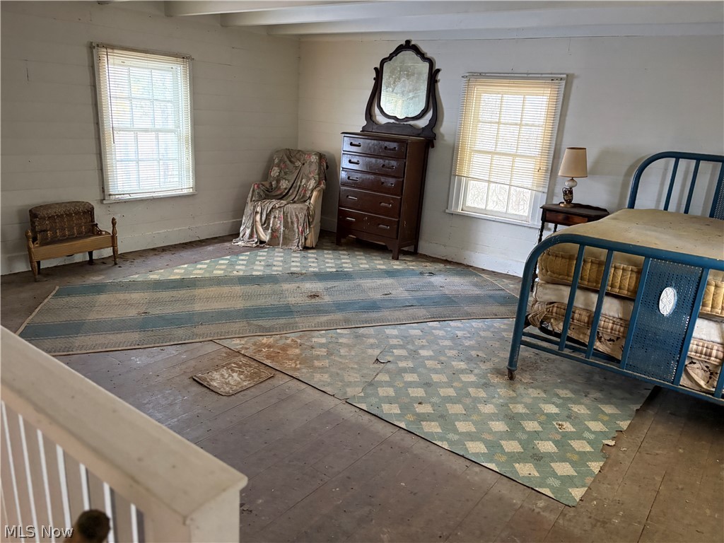 0 Tract 8 Barber Ridge Road Lewisville, OH 43754 - Photo 22 of 49 Bedroom featuring multiple windows, wood-type flooring, and beamed ceiling