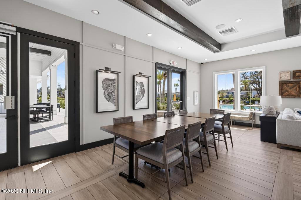 240 Ranch Land Circle St. Johns, FL 32259 - Photo 109 of 117 a view of a a dining room with furniture window and wooden floor