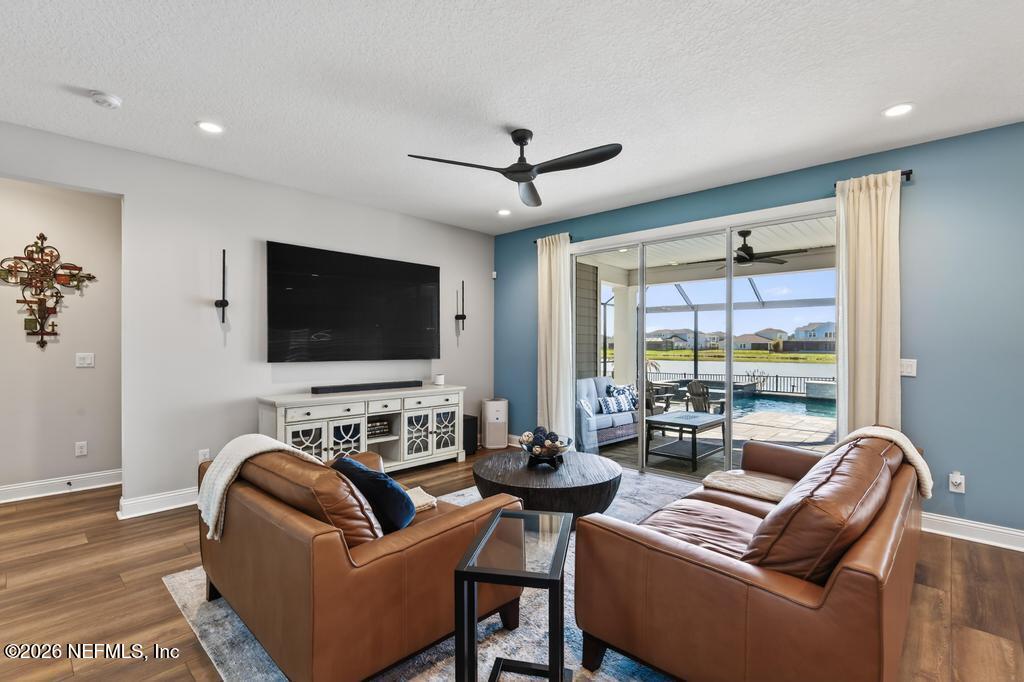 240 Ranch Land Circle St. Johns, FL 32259 - Photo 20 of 117 a living room with furniture and a flat screen tv