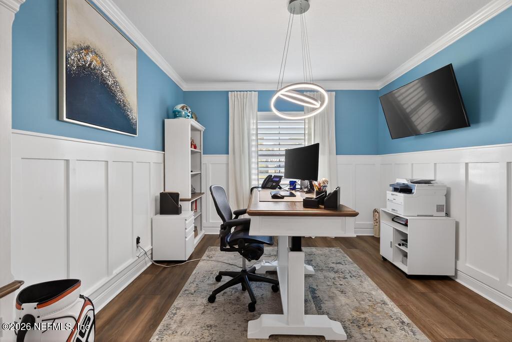 240 Ranch Land Circle St. Johns, FL 32259 - Photo 32 of 117 a view of a workspace with furniture and a flat screen tv