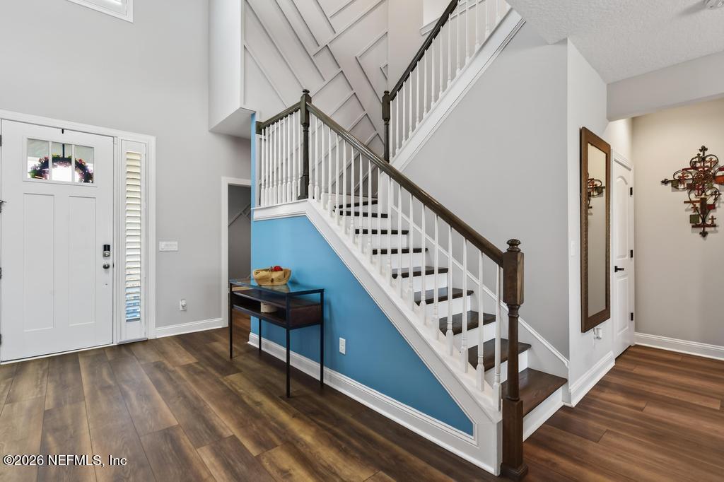 240 Ranch Land Circle St. Johns, FL 32259 - Photo 40 of 117 a view of entryway with wooden floor and stairs