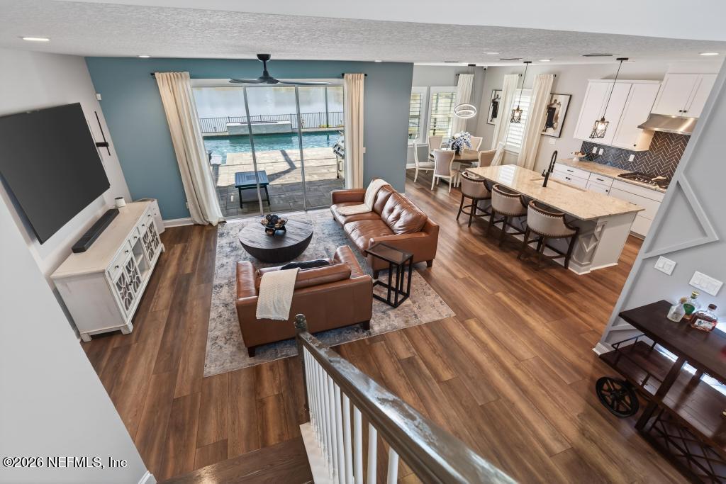 240 Ranch Land Circle St. Johns, FL 32259 - Photo 117 of 117 a living room with fireplace furniture and a flat screen tv