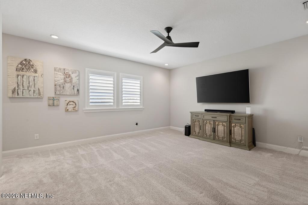 240 Ranch Land Circle St. Johns, FL 32259 - Photo 47 of 117 a living room with flat screen tv and a window