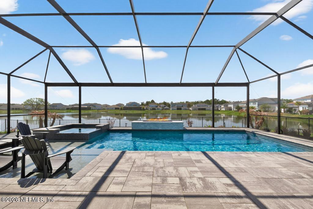 240 Ranch Land Circle St. Johns, FL 32259 - Photo 59 of 117 a view of a living room with furniture and floor to ceiling window