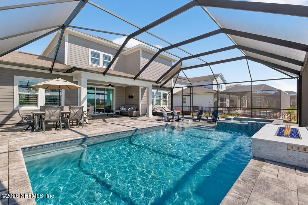 240 Ranch Land Circle St. Johns, FL 32259 - Photo 63 of 117 a view of a backyard with sitting area