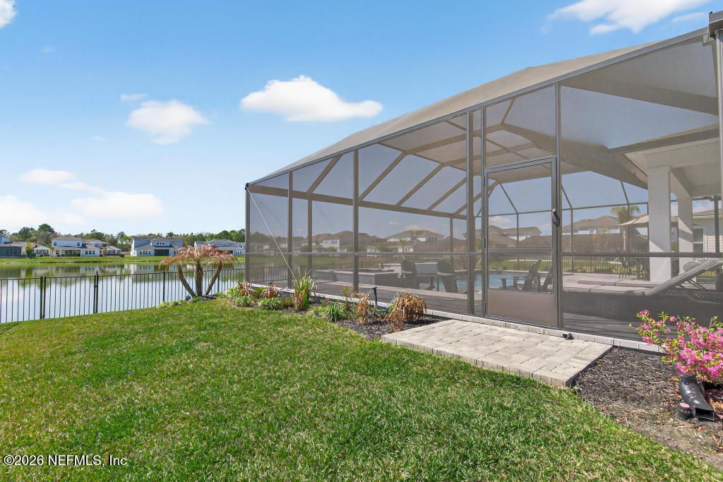 240 Ranch Land Circle St. Johns, FL 32259 - Photo 68 of 117 a view of a backyard with a garden and lake view