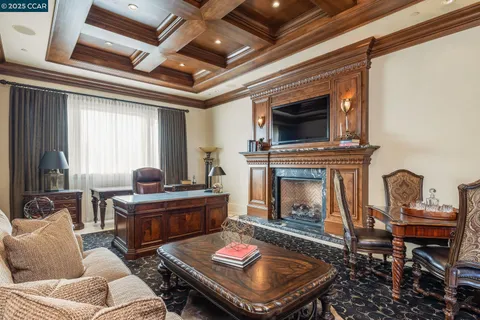 a living room with furniture and a lamp