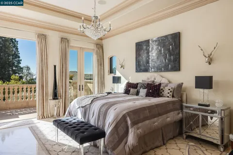 a living room with furniture chandelier and a chandelier