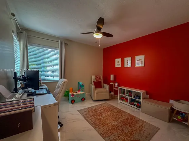 a view of a workspace with furniture