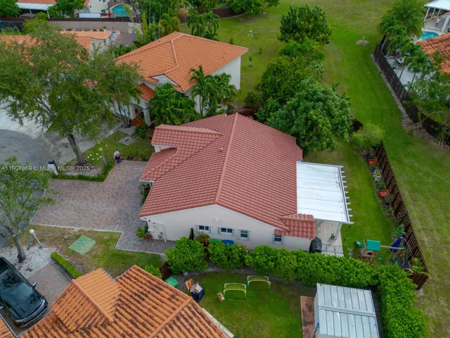 an aerial view of house with yard