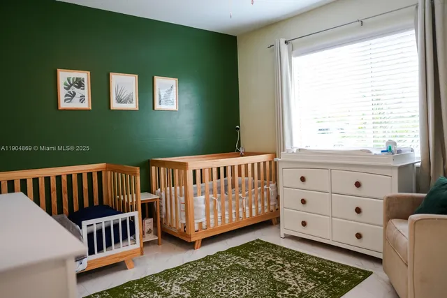 a view of an bedroom with furniture and a window