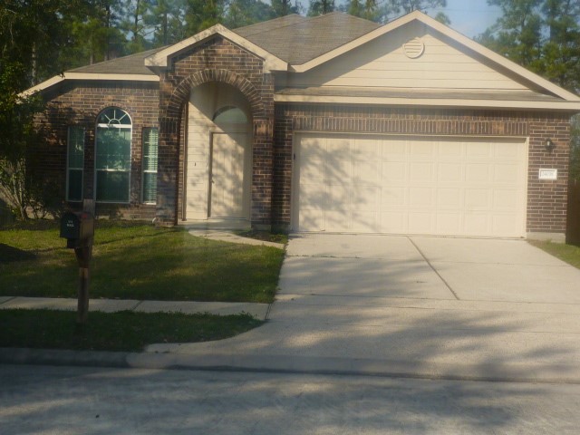 24038 Clipper Hill Lane Spring, TX 77373 - Photo 1 of 14 a front view of a house with a yard