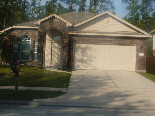 24038 Clipper Hill Lane Spring, TX 77373 - Photo 2 of 14 a front view of a house with garden