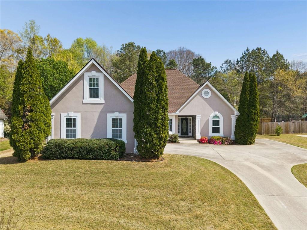 2490 River Run Drive Dacula, GA 30019 - Photo 1 of 1 a front view of a house with a yard