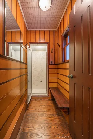 a view of a porch with wooden floor and fence