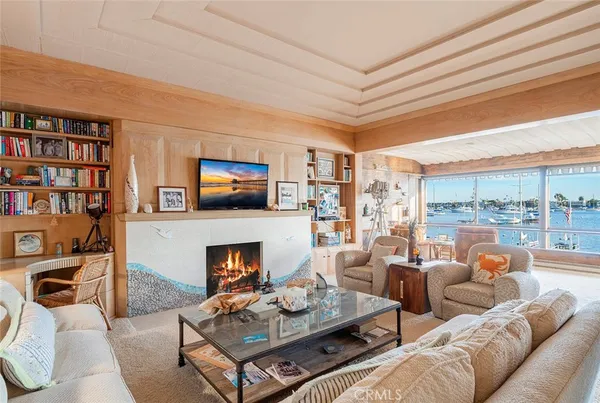 a living room with furniture fireplace and a flat screen tv