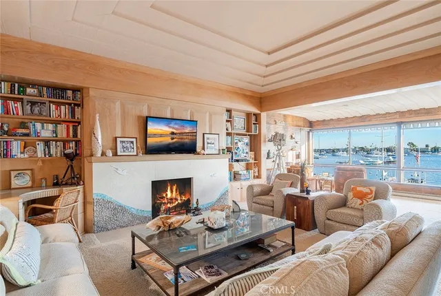 a living room with furniture fireplace and a flat screen tv
