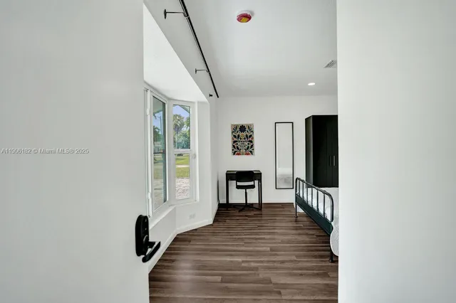 a bathroom with a toilet a sink and shower