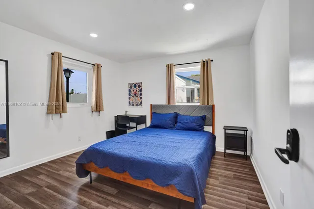 a bathroom with a toilet sink and shower