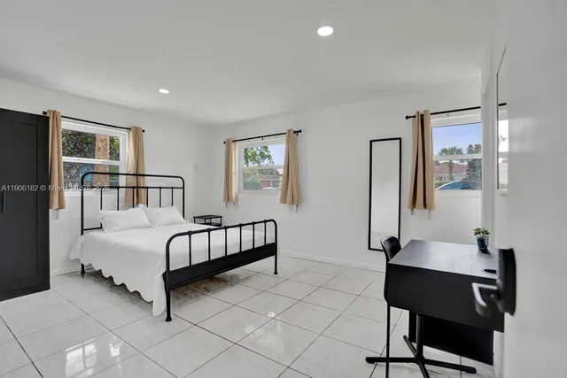 a bathroom with a shower toilet and sink