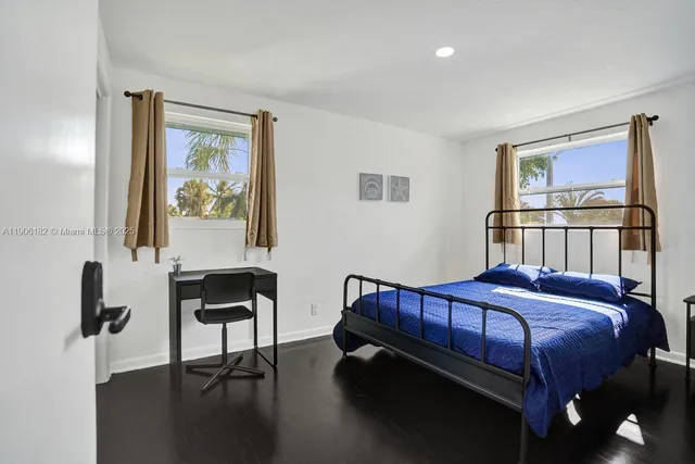 a view of a swimming pool with an outdoor seating