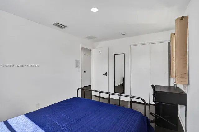 a view of a lake with houses in the background