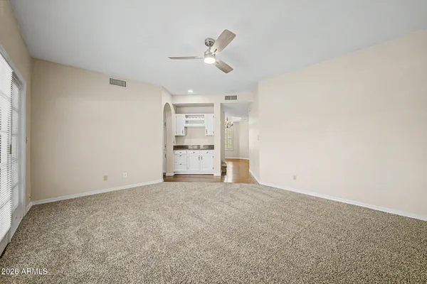 a view of an empty room with a window