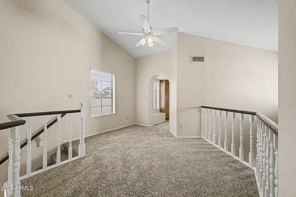 a view of an empty room with windows