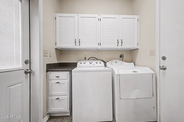 a utility room with dryer and washer