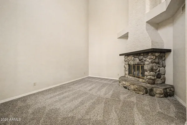 an empty room with hard wood floor