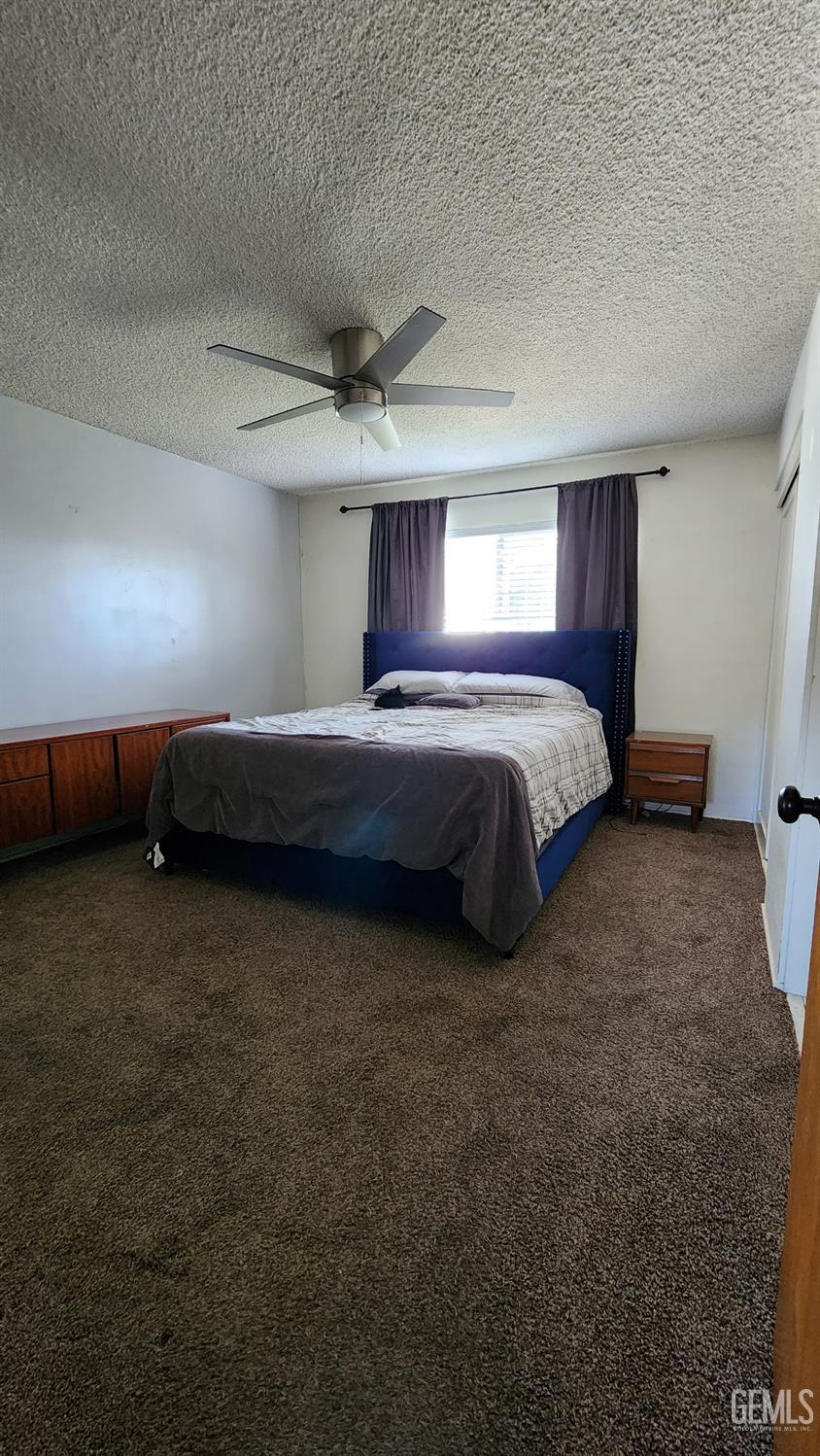 Undisclosed Address Bakersfield, CA 93306 - Photo 13 of 22 a spacious bedroom with a bed and a window