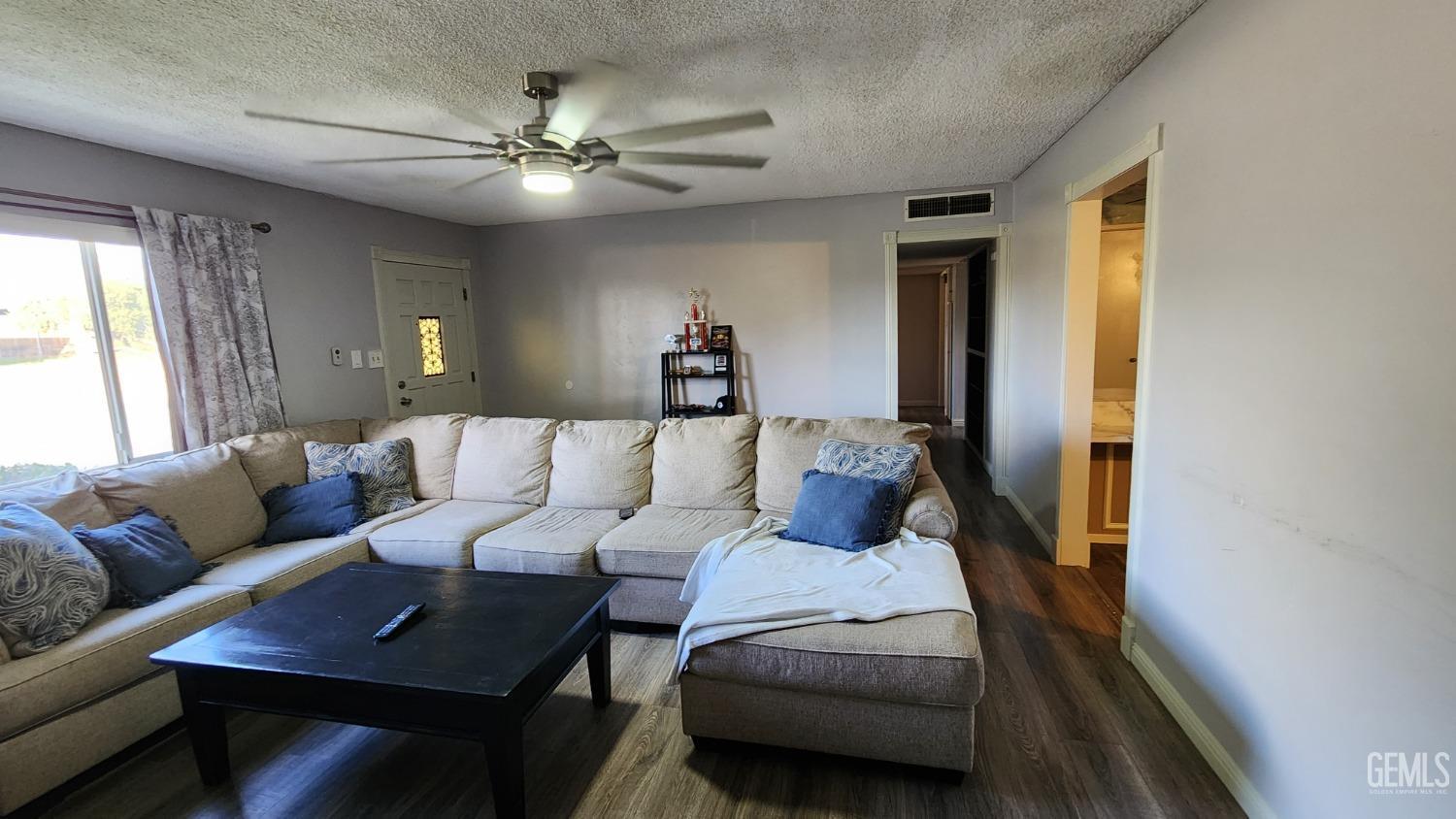Undisclosed Address Bakersfield, CA 93306 - Photo 16 of 22 a living room with furniture and a window