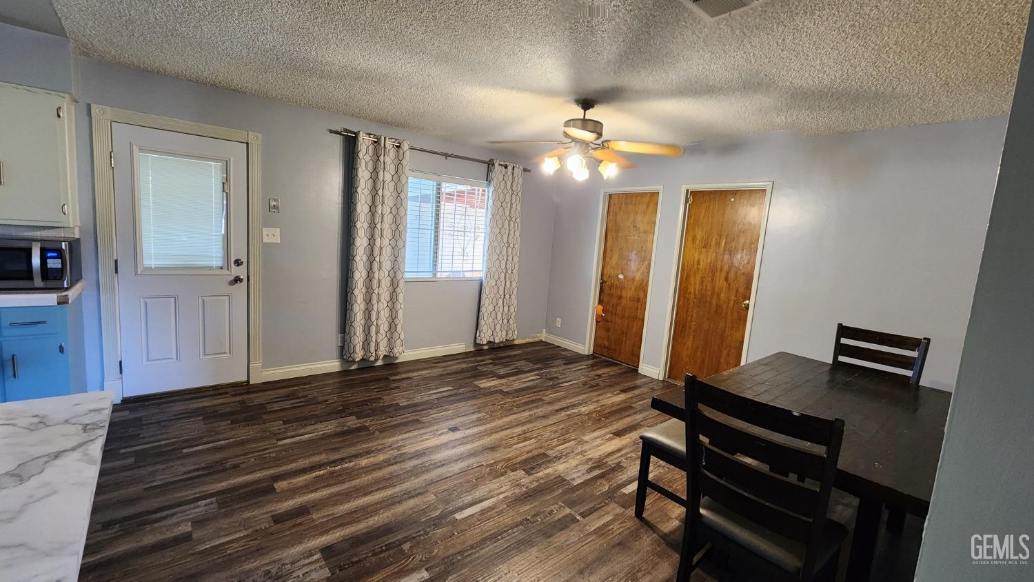 Undisclosed Address Bakersfield, CA 93306 - Photo 17 of 22 a view of an empty room with window and wooden floor