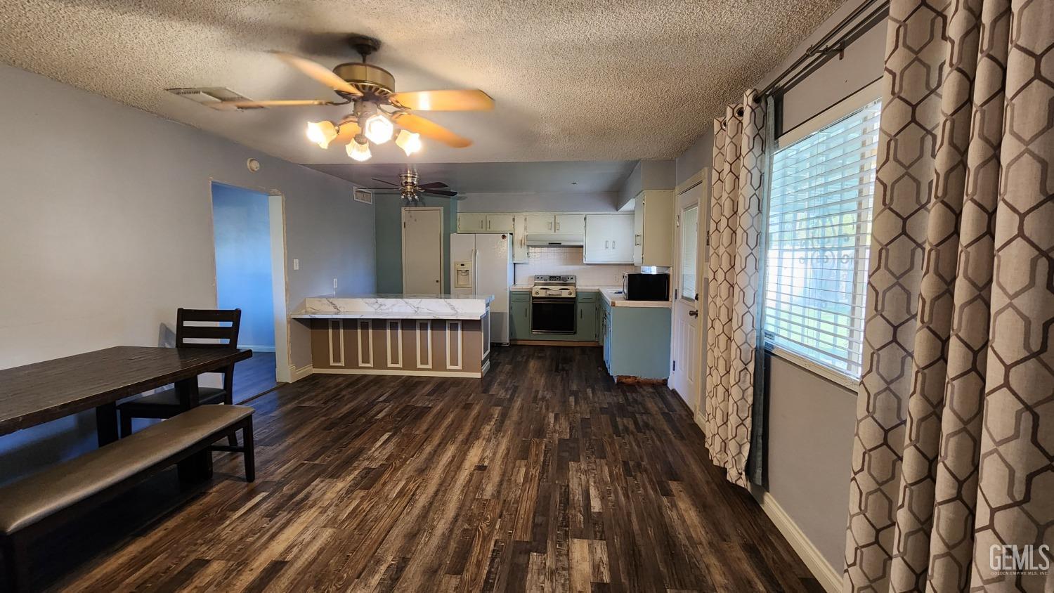 Undisclosed Address Bakersfield, CA 93306 - Photo 19 of 22 a view of a living room with furniture and a window