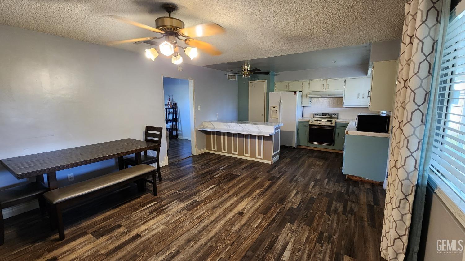 Undisclosed Address Bakersfield, CA 93306 - Photo 20 of 22 a kitchen with sink a stove and cabinets