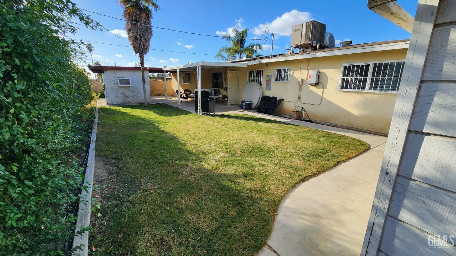 Undisclosed Address Bakersfield, CA 93306 - Photo 2 of 22 a view of a backyard with a patio