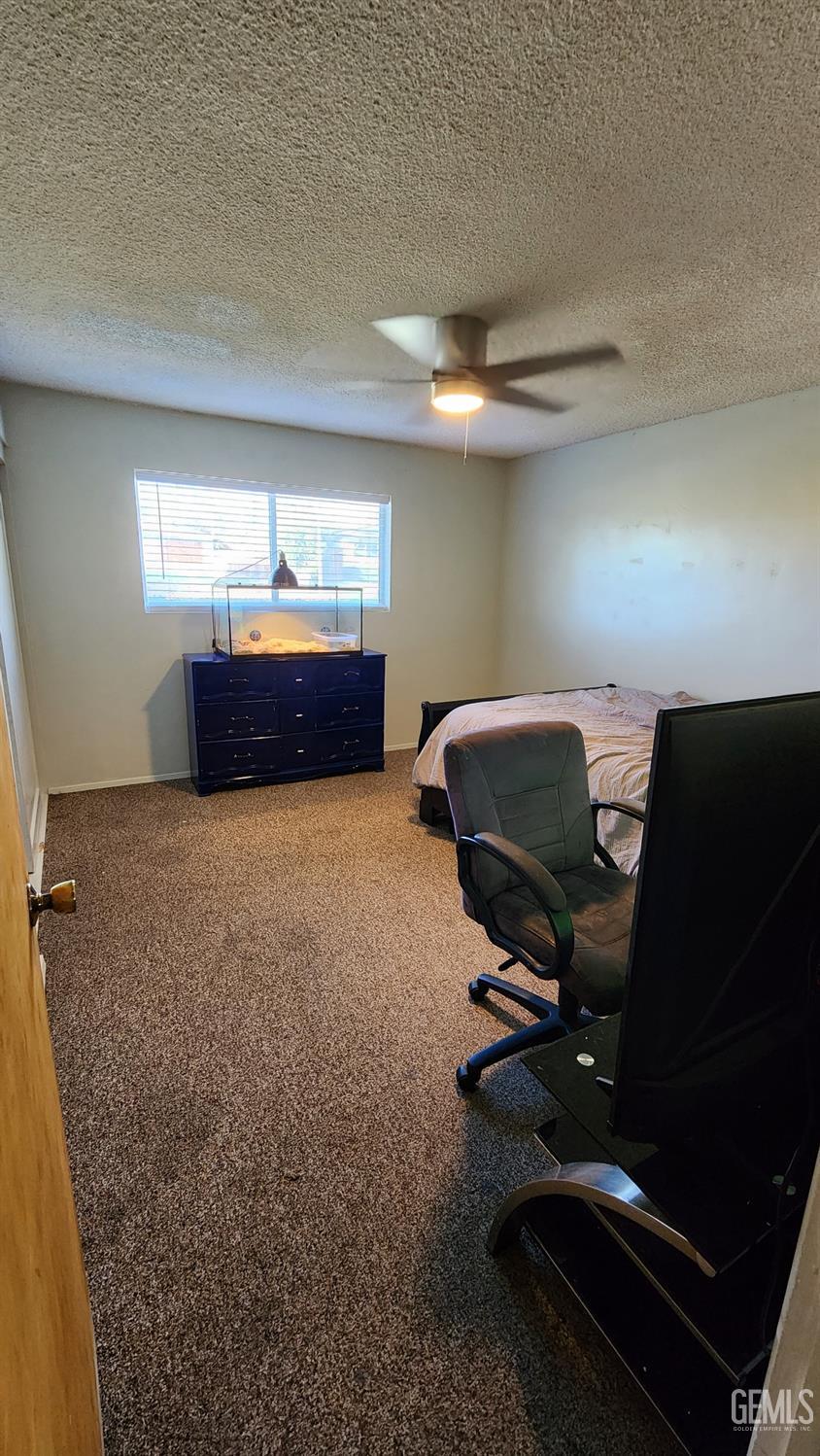 Undisclosed Address Bakersfield, CA 93306 - Photo 8 of 22 a living room with furniture