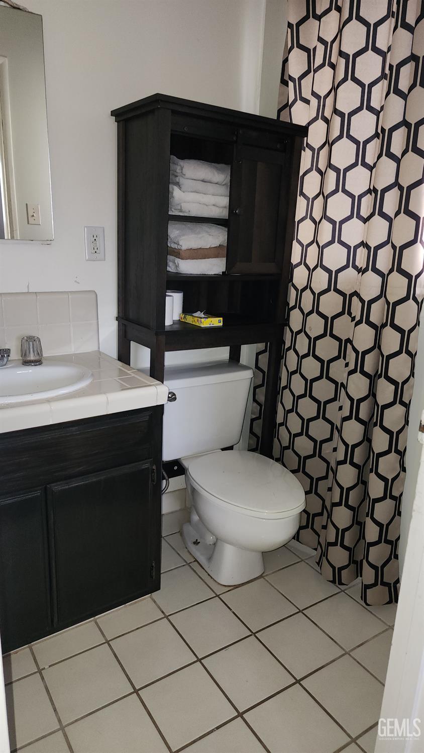 Undisclosed Address Bakersfield, CA 93306 - Photo 10 of 22 a bathroom with a sink toilet and vanity