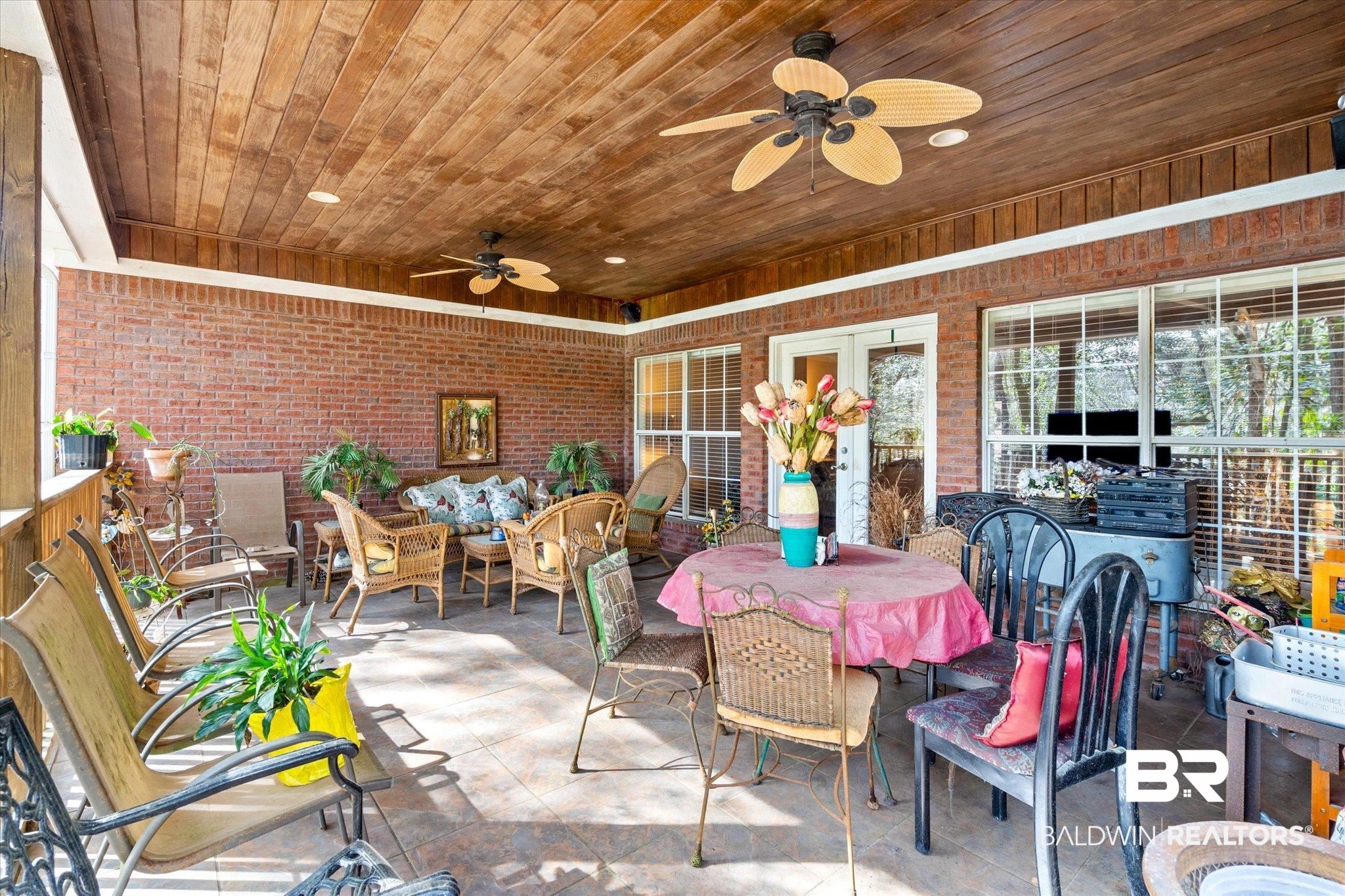 2400 Waterford Road Semmes, AL 36575 - Photo 26 of 30 View of patio with a ceiling fan and outdoor dining space