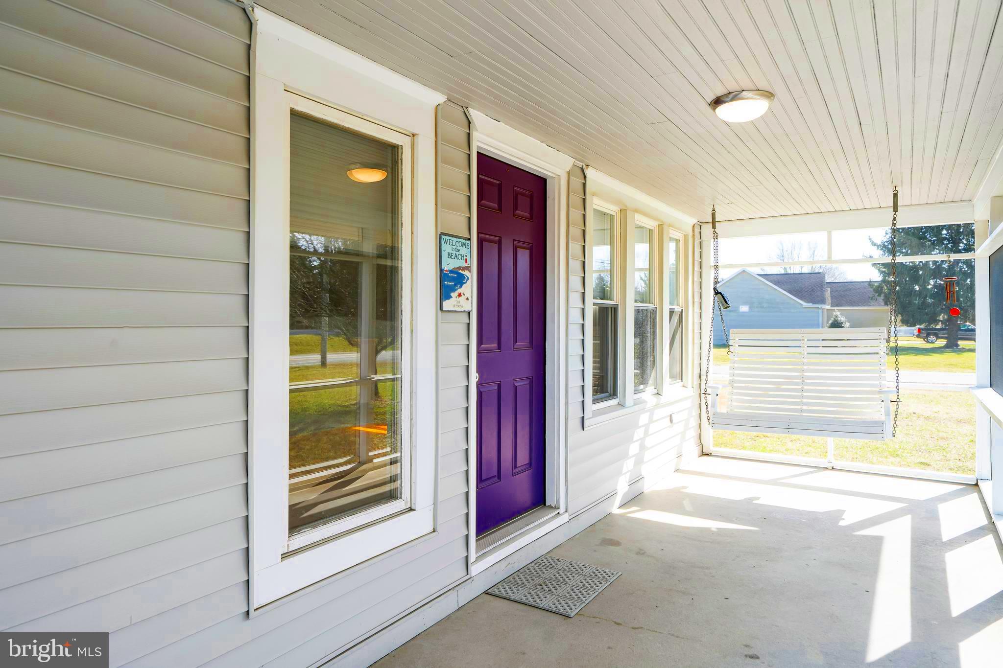 19773 Old Landing Road Rehoboth Beach, DE 19971 - Photo 12 of 54 a view of a wooden door of the house