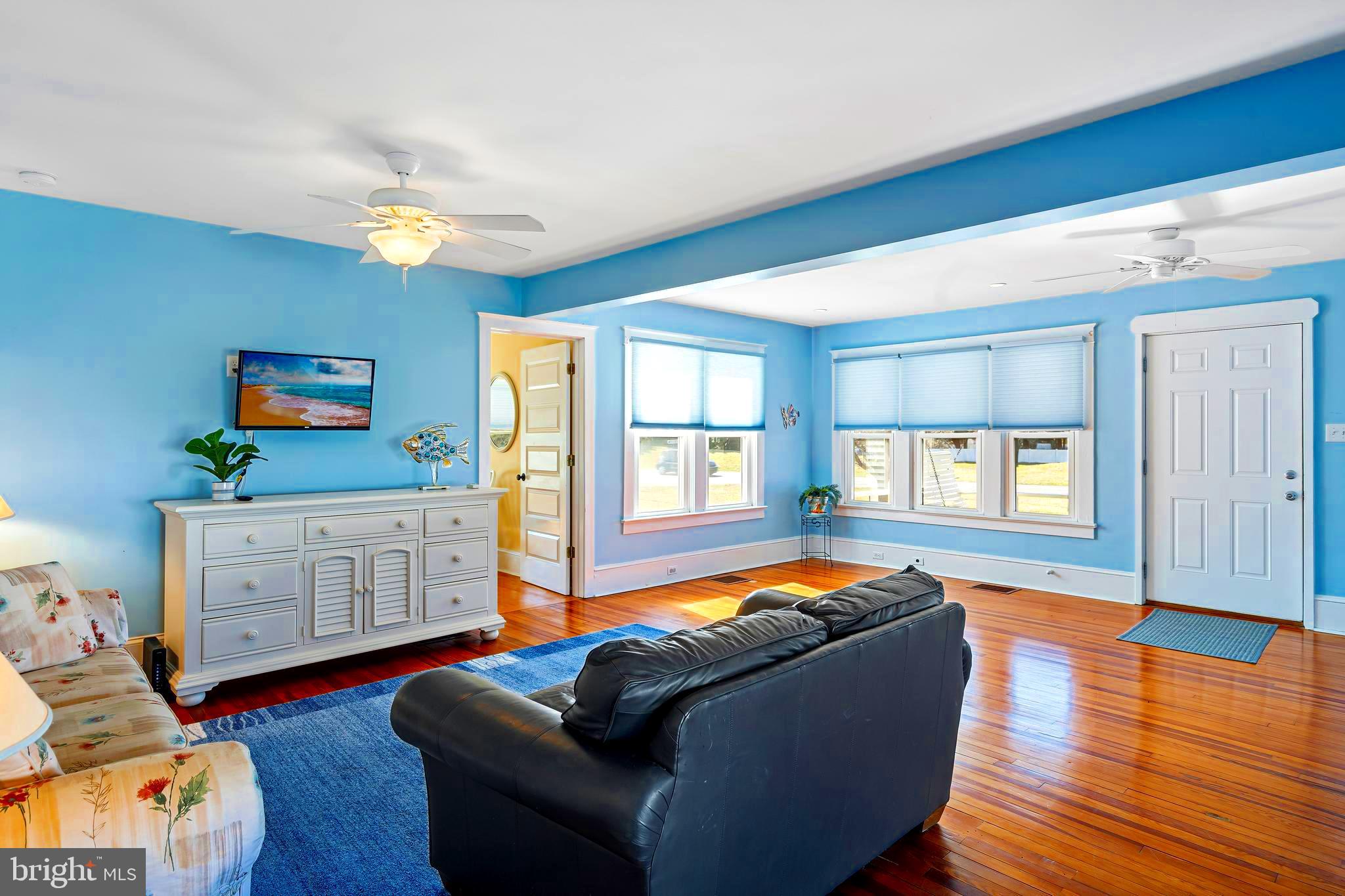 19773 Old Landing Road Rehoboth Beach, DE 19971 - Photo 21 of 54 a living room with furniture and wooden floor